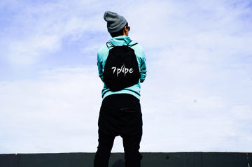 7Pipe lifestyle image featuring a person wearing a 7Pipe backpack